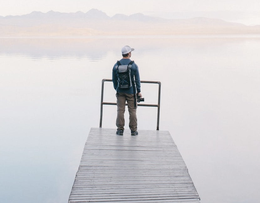 image of a person standing at the end of a pier